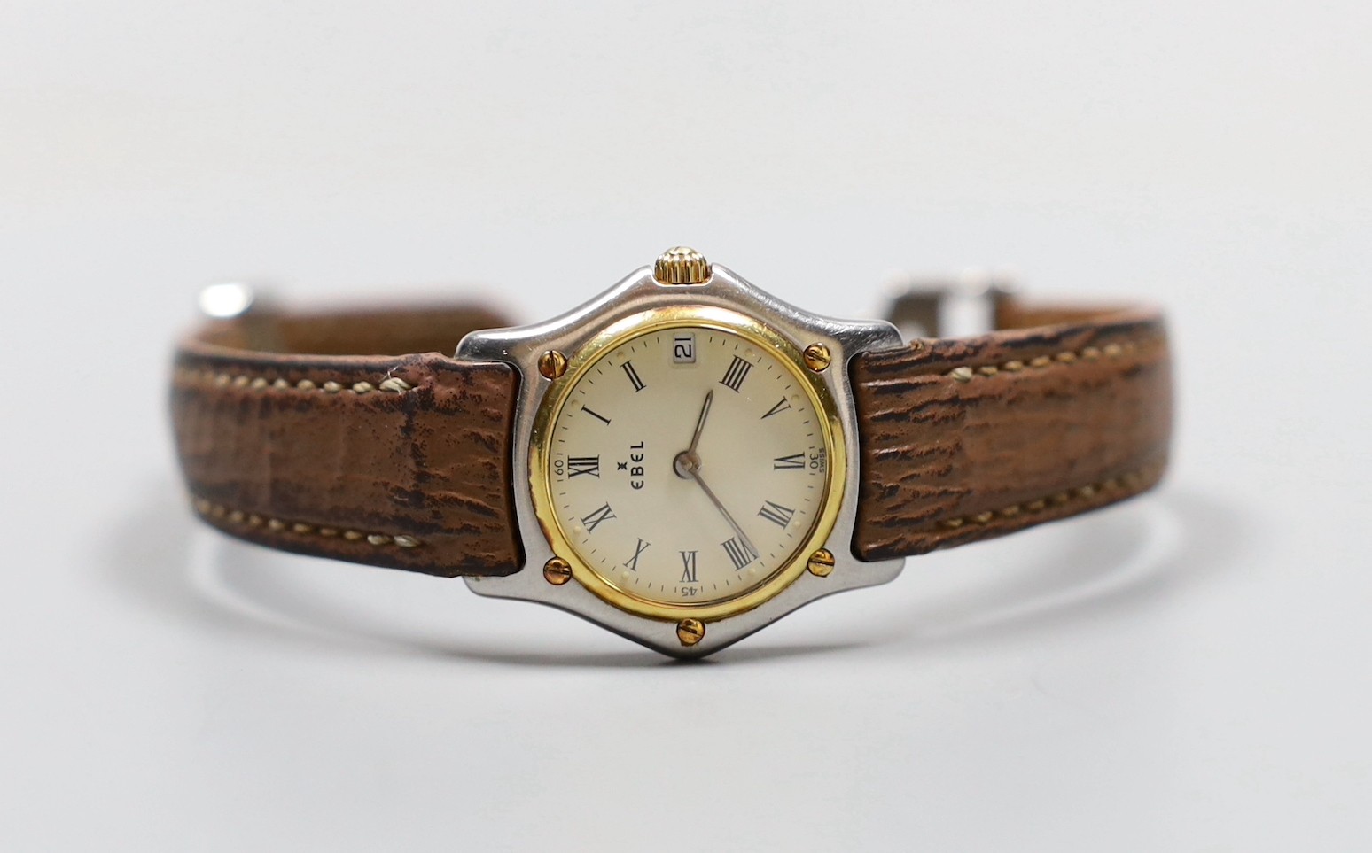 A lady's 18K and steel Ebel 1911 quartz wrist watch, on a leather strap with steel deployment clasp, no box or papers.
